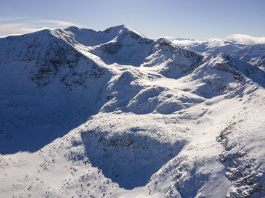 Amazing Aerial Winter view of Rila mountain near Musala peak, Bulgaria clipart