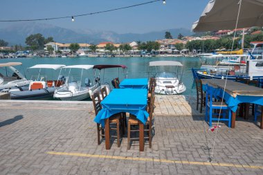 VASILIKI, LEFKADA, GREECE - AUGUST 25, 2023: Summer Panorama of village of Vasiliki at Lefkada, Ionian Islands, Greece clipart