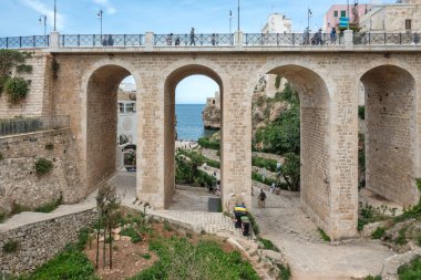 POLIGNANO A MARE, ITALY - MAY 13, 2024: Amazing view of The Old town of Polignano a Mare, Apulia Region, Italy clipart