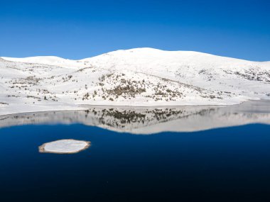 Amazing Aerial winter view of Rila mountain near Belmeken Dam, Bulgaria