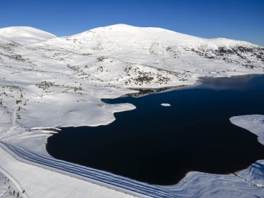 Amazing Aerial winter view of Rila mountain near Belmeken Dam, Bulgaria