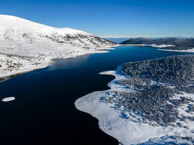 Amazing Aerial winter view of Rila mountain near Belmeken Dam, Bulgaria