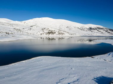Amazing Aerial winter view of Rila mountain near Belmeken Dam, Bulgaria