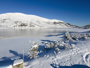 Amazing Aerial winter view of Rila mountain near Belmeken Dam, Bulgaria