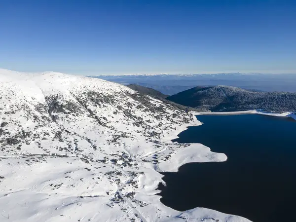 Amazing Aerial winter view of Rila mountain near Belmeken Dam, Bulgaria