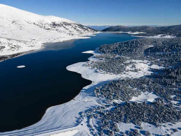 Amazing Aerial winter view of Rila mountain near Belmeken Dam, Bulgaria