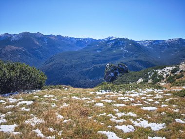 Amazing Autumn landscape of Rila Mountain near Mechit and Popova Kapa peaks, Bulgaria clipart