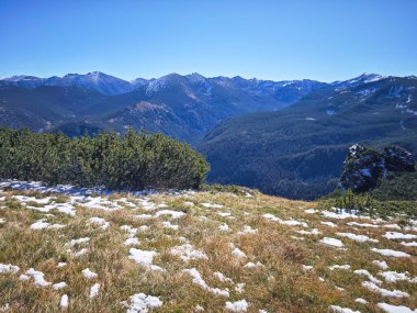 Amazing Autumn landscape of Rila Mountain near Mechit and Popova Kapa peaks, Bulgaria clipart