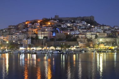 KAVALA, GREECE - DECEMBER 26, 2023: Amazing Sunset Panorama of city of Kavala, Eastern Macedonia and Thrace, Greece clipart