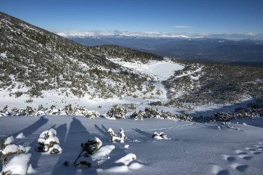 Amazing Winter view of Pirin Mountain near Polezhan and Bezbog Peaks, Bulgaria clipart