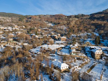 Aerial Winter Sunset view of Village of Kovachevitsa with Authentic nineteenth century houses, Blagoevgrad Region, Bulgaria clipart