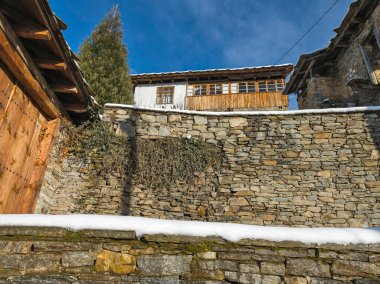 Winter view of Village of Kovachevitsa with Authentic nineteenth century houses, Blagoevgrad Region, Bulgaria clipart