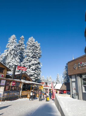 BOROVETS, BULGARIA - FEBRUARY 20, 2025: Winter view of ski resort of Borovets at Rila Mountain, Sofia Region, Bulgaria clipart