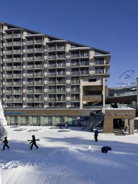 BOROVETS, BULGARIA - FEBRUARY 20, 2025: Winter view of ski resort of Borovets at Rila Mountain, Sofia Region, Bulgaria clipart