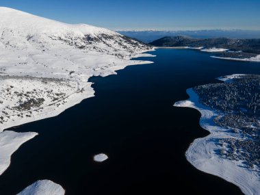 Amazing Aerial winter view of Rila mountain near Belmeken Dam, Bulgaria