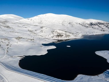 Amazing Aerial winter view of Rila mountain near Belmeken Dam, Bulgaria