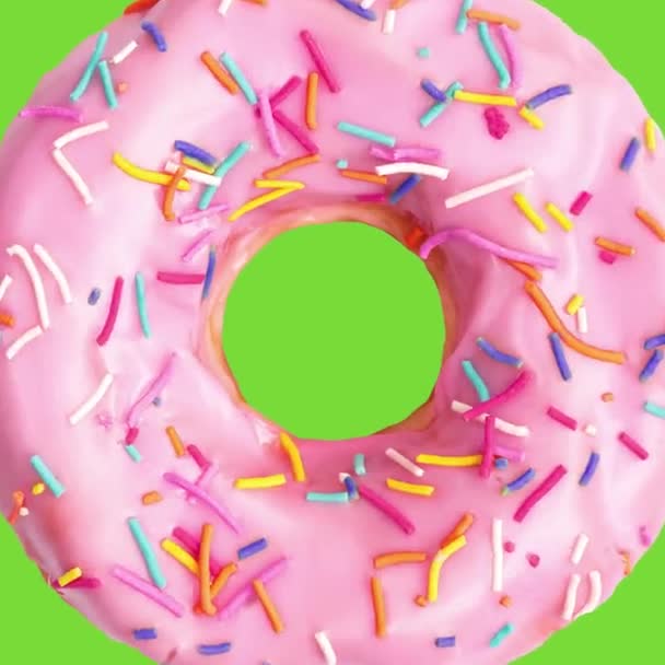 Ροζ Ντόνατ Διακοσμημένα Πολύχρωμα Τρούφα Πράσινο Φόντο Οθόνη Γλυκό Ντόνατ — Αρχείο Βίντεο