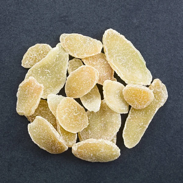Sweet Spicy Candied Crystallized Ginger Slices Photographed Overhead Slate — Stock Photo, Image