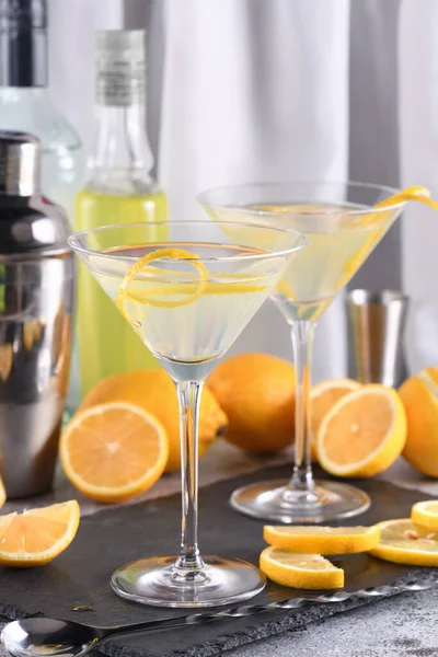 stock image Lemon drop martini with zest offers a sophisticated twist to a cocktail. This light and savory favorite combines vodka, orange liqueur, fresh lemon juice and zest.