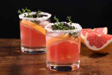 Pink Paloma with red grapefruit and tequila. The red grapefruit adds the perfect amount of sweetness, and the vibrant color of the juice makes this a great cocktail. Organic vegetarian drink.