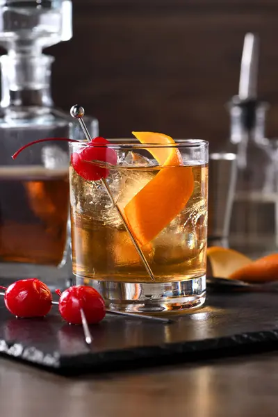 stock image Cocktail Old Fashioned is an old-fashioned sophistication of whiskey and sweet syrup. Served with ice, orange zest and Maraschino cherry. 