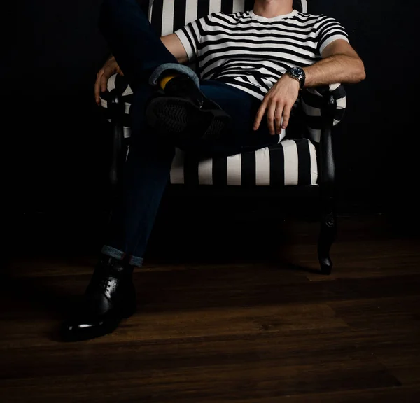 Unrecognizable Man Striped Shirt Sits Striped Armchair — Stock Photo, Image