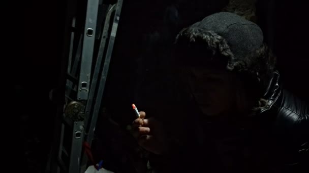 Woman Black Jacket Smokes Cigarette Dark Blows Out Smoke — Stockvideo