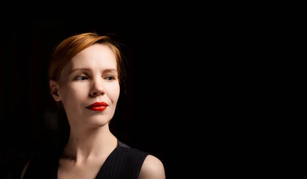 Woman Red Lips Black Background Looks Side Middle Aged Forty — Stockfoto
