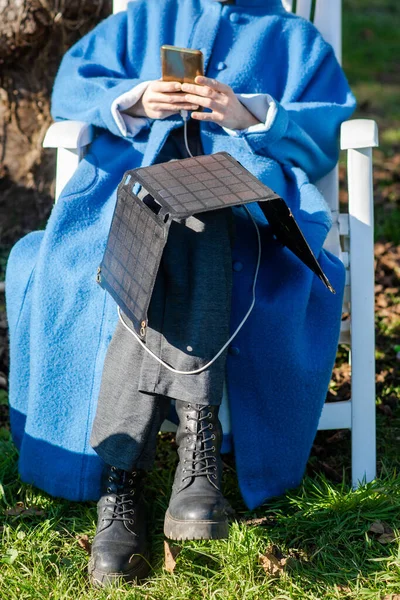 Unrecognizable Woman Mobile Phone Her Hands Portable Solar Battery Sits — Stok fotoğraf