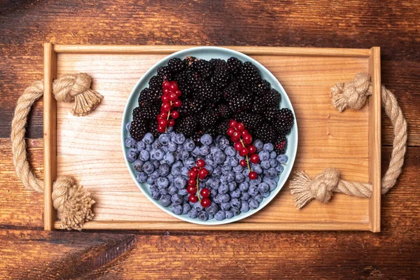 Mix Fresh Berries Blueberries Blackberries Red Currants Plate Wooden Tray — Stock Photo, Image