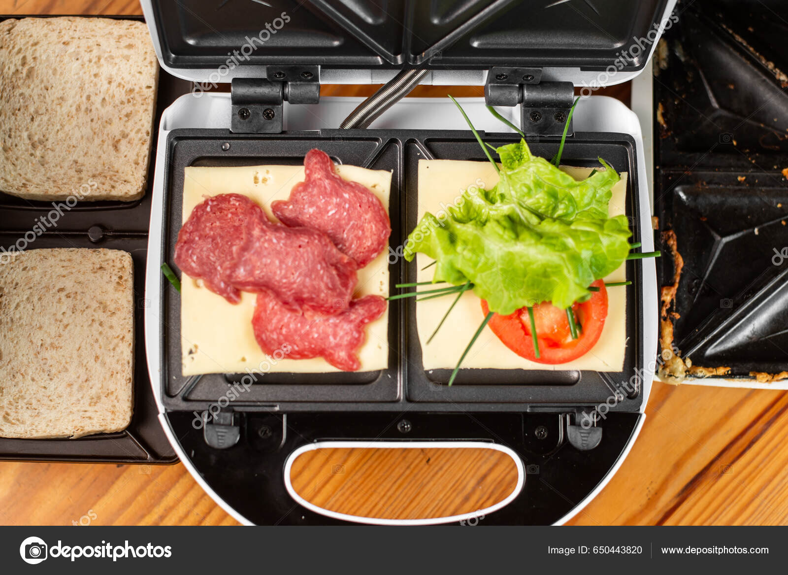 Sandwich Maker Two Different Sandwiches Tomatoes Ham Onions Cheese  Preparing Stock Photo by ©Nebasin 650443820