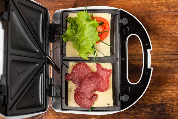 stock image Vegetarian and meat sandwich in a sandwich maker. Different types of sandwich fillings.