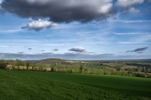 View of the countryside in France. Sky with clouds. Spacious volumetric view of the green meadows.