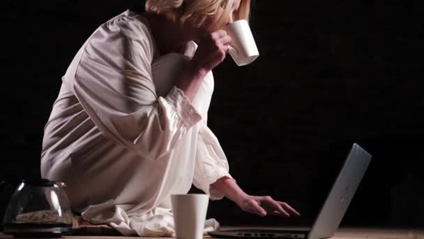 Woman Drinks Coffee Front Laptop Empty Dark Room Deadline Concept — Stock Video