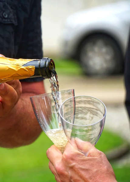Champagne Pouring Two Glasses Stock Photo