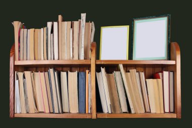 Homemade wooden shelf with books and photos. Isolate on black clipart