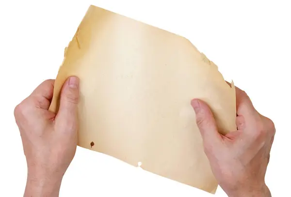 Egy Öreg Sárga Papírlapot Tart Kezében Fehér Alapon Elszigetelve Stock Kép