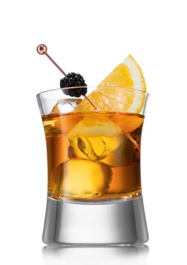 Old fashioned cocktail with ice cubes and blackberry with orange slice on white.
