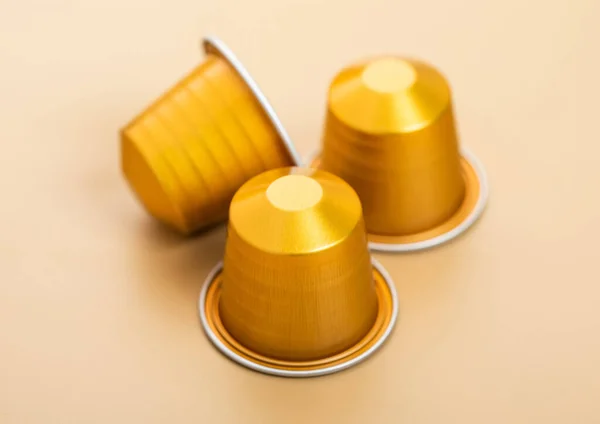 Coffee capsules pods for coffee machine on beige background.Top view.