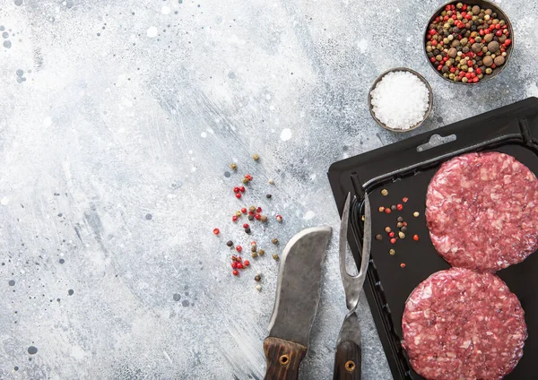 Beef Fresh Raw Burgers Vacuum Tray Fork Knife Light Background — Stock Photo, Image