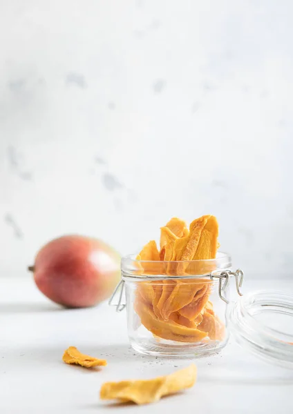 Dried Mango Pieces Glass Jar Raw Fruit Light Background Macro — Stock Photo, Image