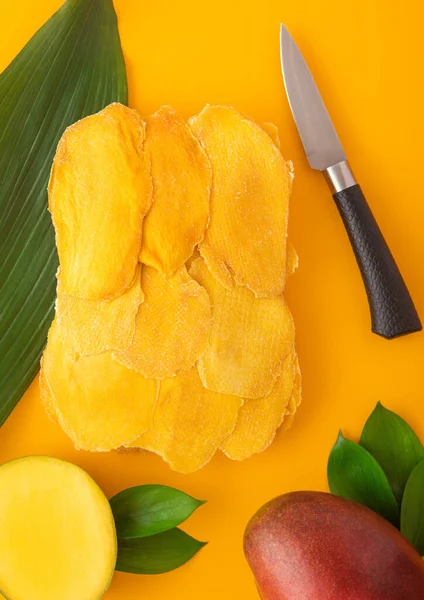 Dried Sweet Mango Slices Yellow Background Raw Fruit Knife Top — Stock Photo, Image