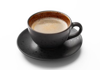 Porselen fincanda büyük siyah kahve ve beyaz çay tabağı..