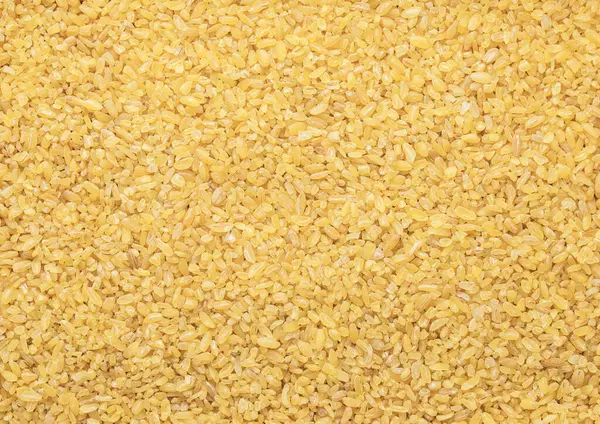 Yellow Raw Organic Healthy Bulgur Grain Seeds Textured Background Royalty Free Stock Images