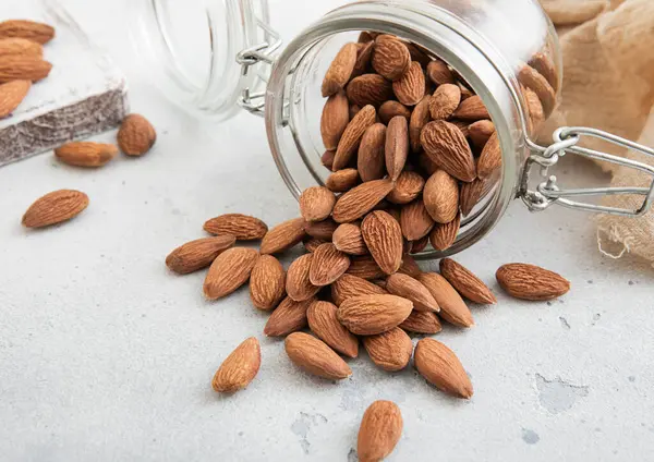 Raw Healthy Organic Almond Nuts Snack Glass Jar White Kitchen Ліцензійні Стокові Зображення