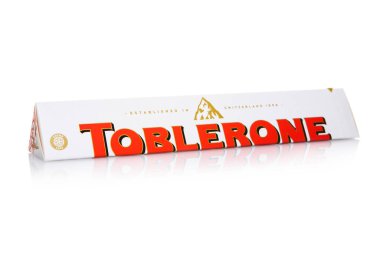 LONDON, UK - DECEMBER 21, 2024: Toblerone White Milk Chocolate with Honey and Almond Nougat on white. clipart