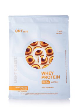 LONDON, UK - 15 Mart 2025: QNT creme brulee light digest whey protein with bcaa and fiber on white.