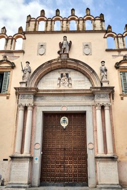 Gate to the historic Bishop's Palace - Palazzo del Vescovado in the city of Verona, Italy