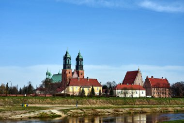 Historic buildings and towers of the cathedral on the river Warta in the city of Poznan, Poland