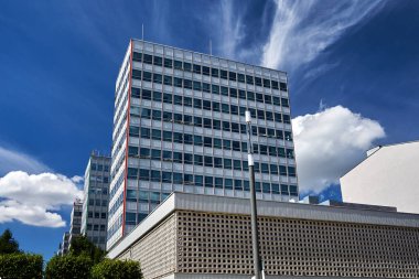 street with modernist office buildings made of glass and aluminum in the center of Poznan, Poland